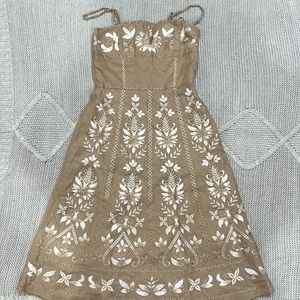 Two Antonio Melani pieces: Elegant embroidered dress, brown embroidered skirt